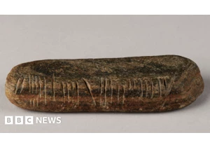Stone with ancient writing system unearthed in garden