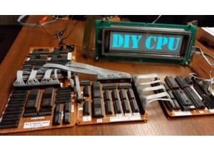 Enthusiast builds a fully functional CPU from old memory chips — hand-solders every wire, writes 1800 lines of assembler code, and makes it play The Matrix on a VFD display