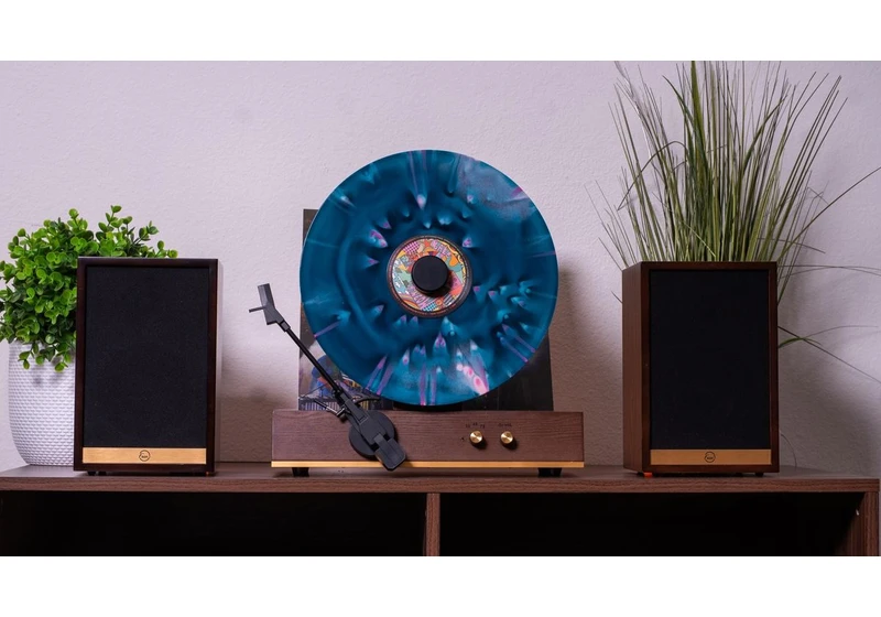 I doubt this retro-style vertical turntable and speakers combo is a good idea, but doesn't it look incredible?