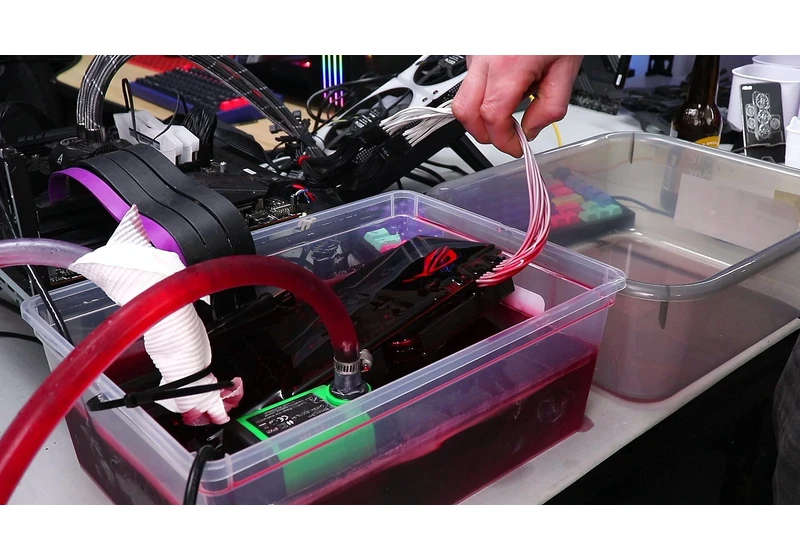 Nvidia 1080 Ti dunked into car transmission fluid for overclocking experiments using a Dodge Journey transmission cooler as a radiator — DIY immersion cooling rig delivers 7% to 16% gains
