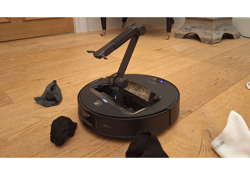 Roborock’s new robovac has a mechanical arm that can pick up your socks and maybe also play with your cat