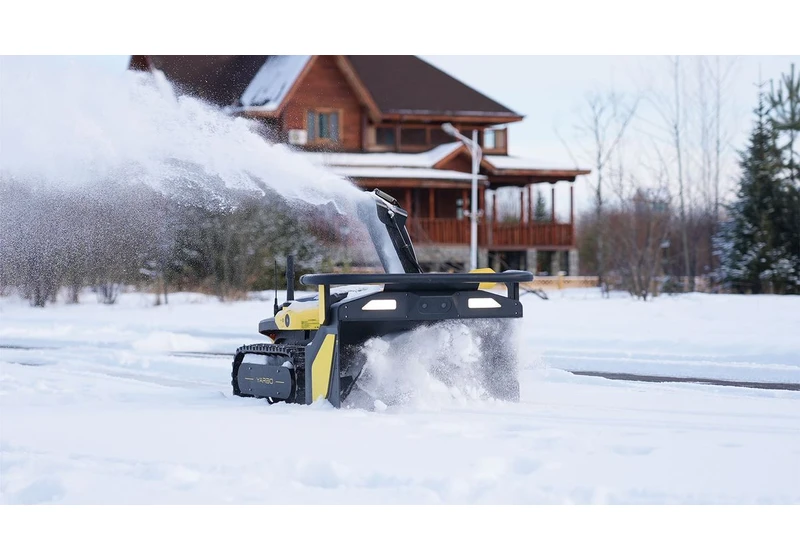 This robot lawn mower turns into a snow blower, and I've never wanted to wake up to a blocked drive more